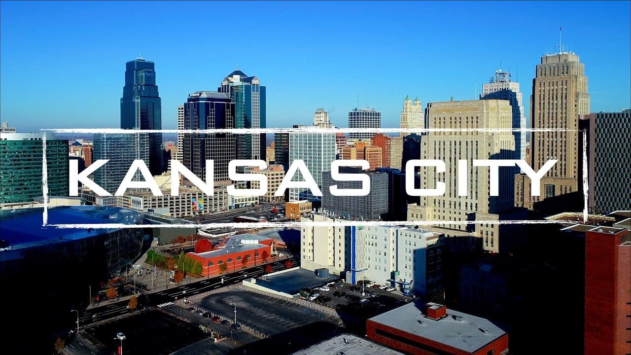 A city with the words kansas city written in front of it.